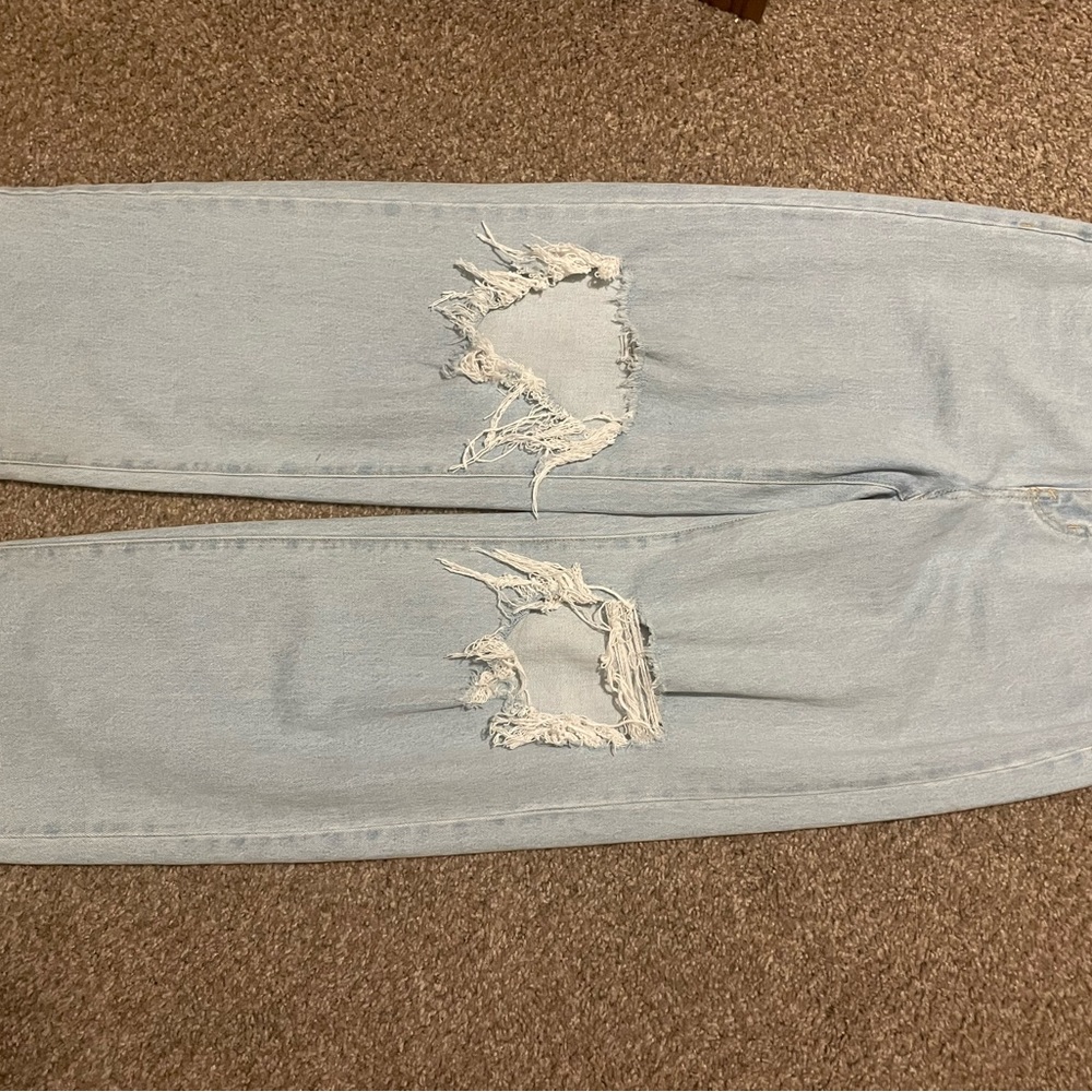 ripped light blue jeans